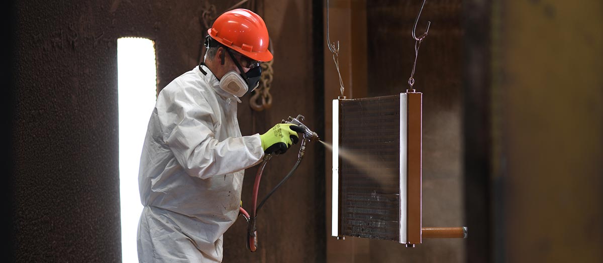 Man Spraying Coils